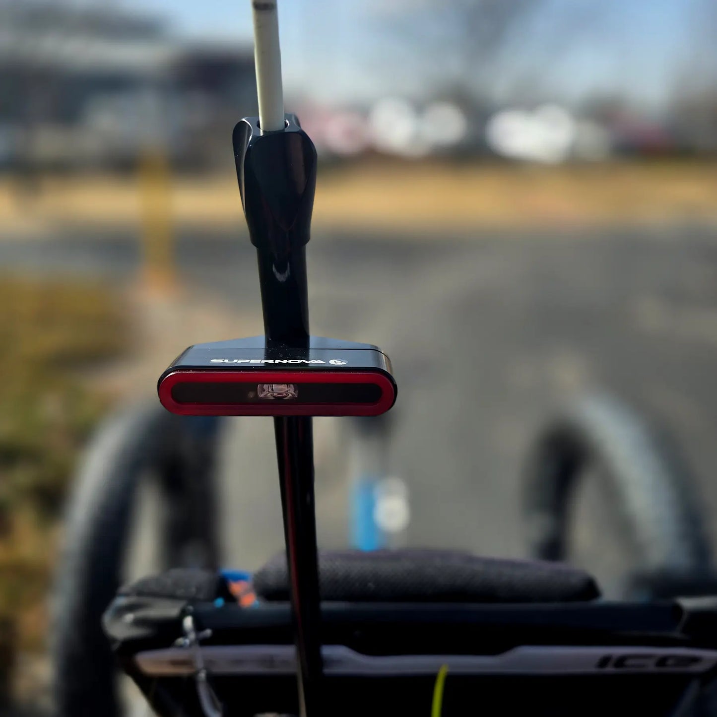 Closeup view of the taillight on the ICE Full Fat RS Rohloff Shimano EP8 Hostel Shoppe Limited Edition Custom Blue Recumbent Trike outside in front of the Hostel Shoppe.