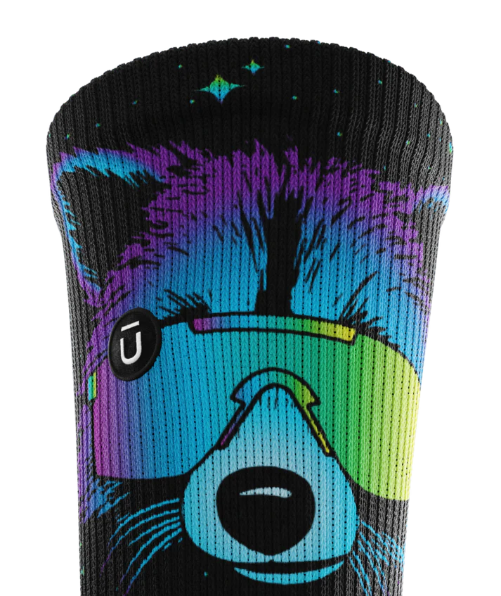Top cuff of black sock printed with a racoon head in blue, purple and teal wearing yellow sunglasses. Circular black patch with white Outway logo on top third of cuff.