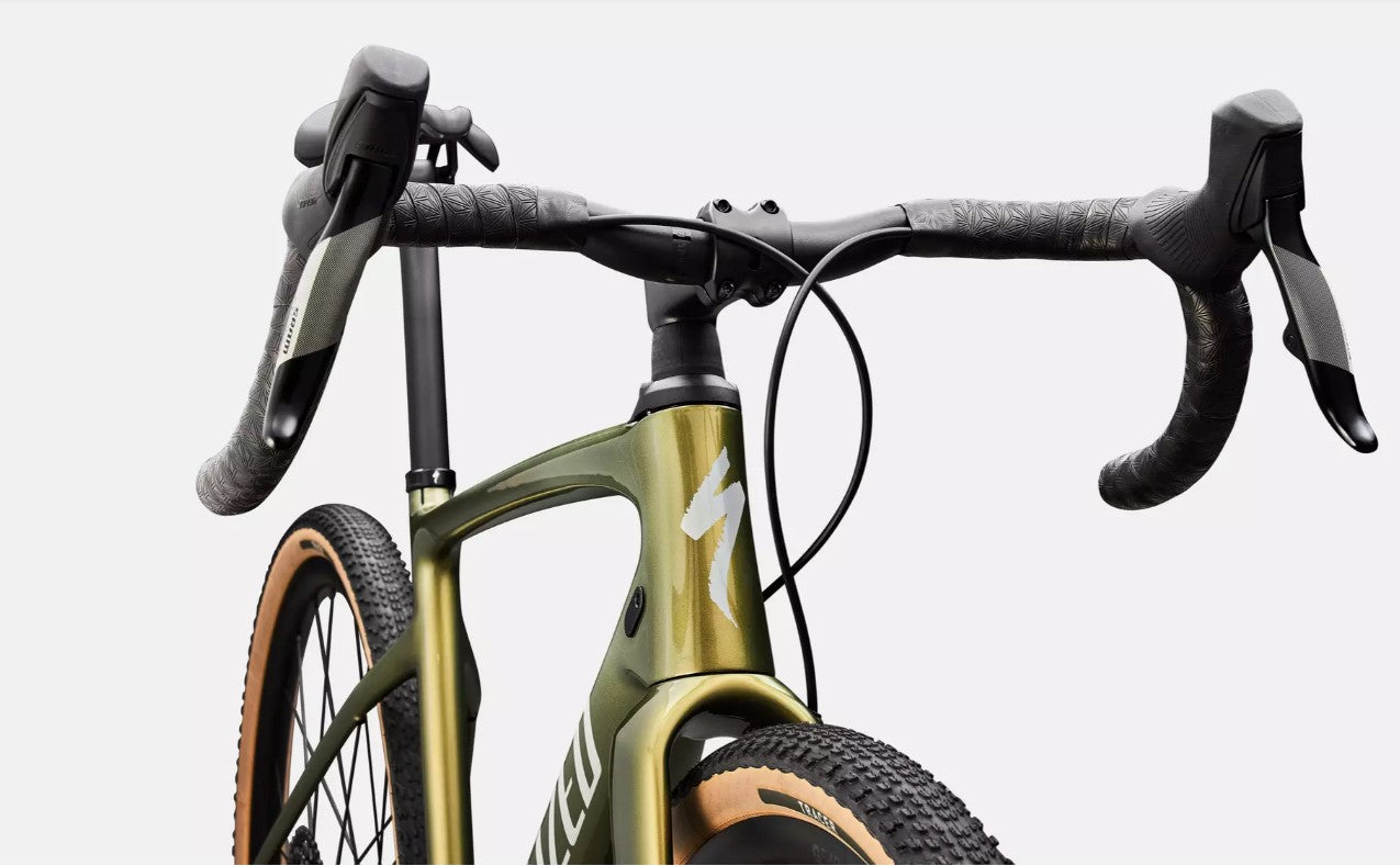 Front close-up of a Specialized olive green bicycle's handlebar with a white background.