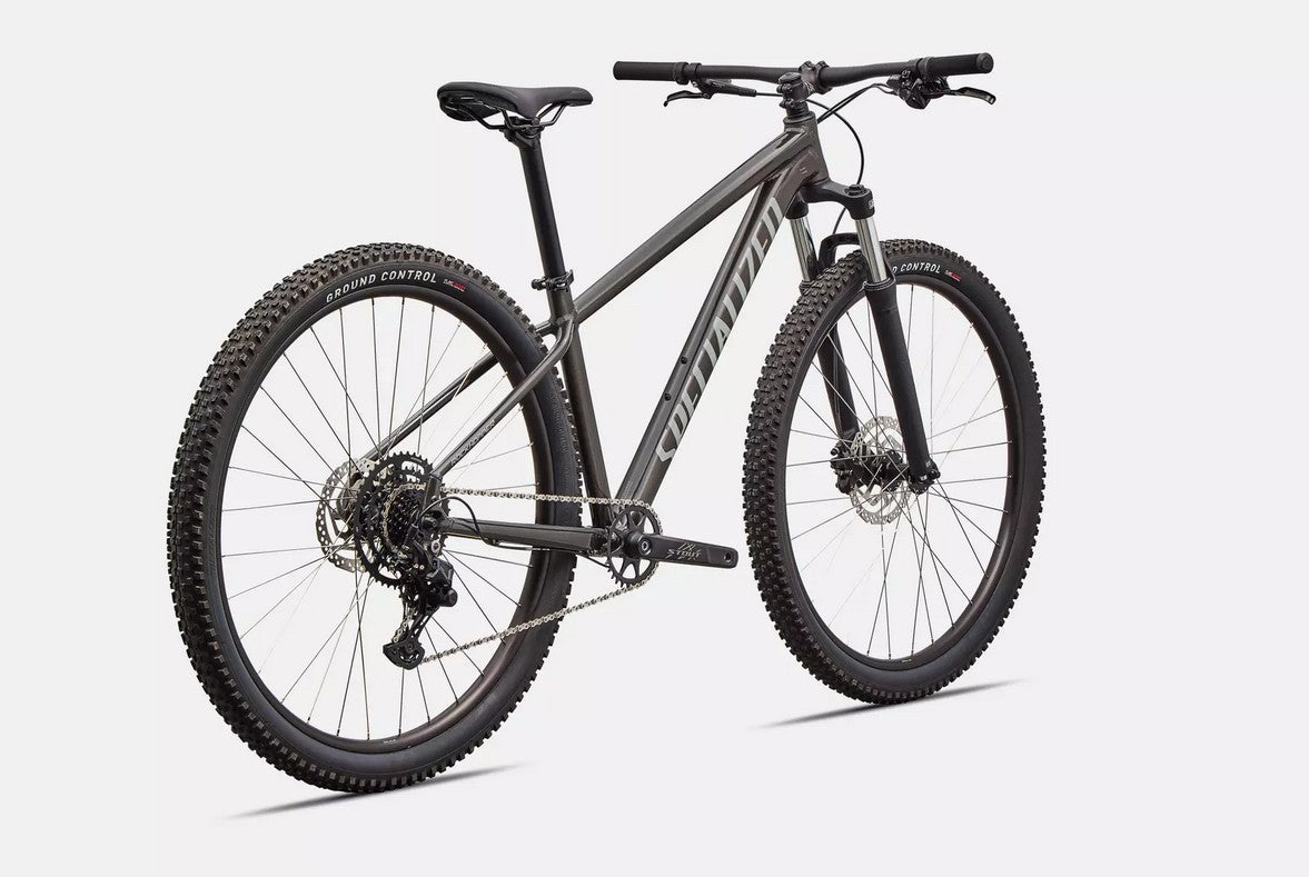 Dark grey Specialized Rockhopper mountain bike on a white background.