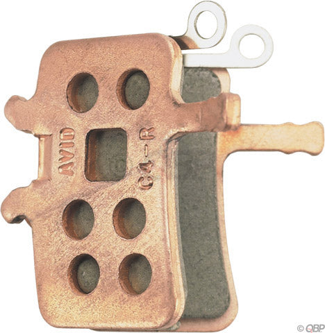 Avid BB7 & Juicy Metallic Disc Brake Pads, you can se the bronze brake bad backing on a white backround.