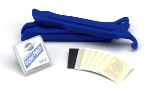Studio image of Park Tool Repair Kit (TR-1) with three blue tire levers, a patch kit, and multiple patches.