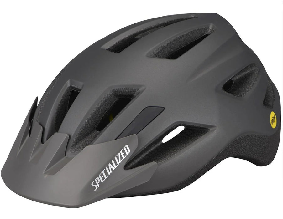 Left profile studio view of black Specialized Shuffle youth helmet with white Specialized lettering on black visor and yellow MIPS logo on back left side of helmet