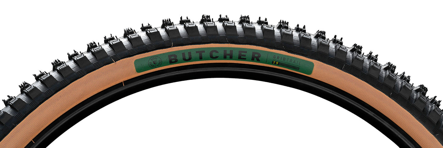 Sidewall view of a black Specialized Butcher T9 Grid Trail tire with tan sidewalls and a green Butcher logo