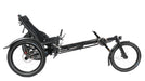 Studio image of right profile view of a Hase Kettwiesel recumbent delta style trike with one wheel in the front and two in the bac. The frame and fork are black and the seat is black mesh.