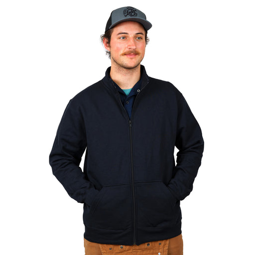 Male model wearing with both hands in side pocket of navy blue full zip jacket wearing a grey and black Hostel Shoppe logo hat
