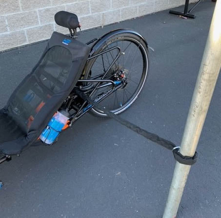 HP Velotechnik AXA Lock Chain 100cm being used to lock an HP velotechnik trike to a metal post