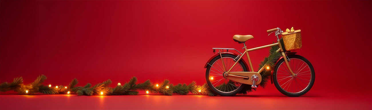A gold bike and greenery with holiday lights are set against a red background.