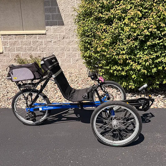 Side view of the TerraTrike Used Rover Cobalt 8 speed Recumbent Trike in an outdoor setting.