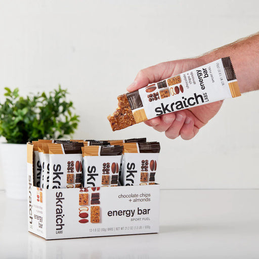 skratch-labs-anytime-energy-bar-box12-chocolate-chips-almonds-hand-holding-bar