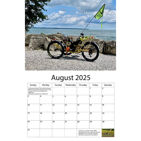 A yellow Azub trike sits in front of Lake Erie for August 2025.