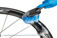 Studio image of soft bristled brush cleaning rim of bicycle