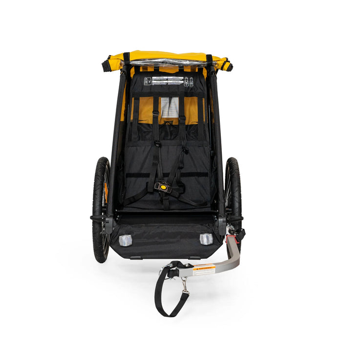 Burley Bee Single Child Trailer Yellow with protective cover folded back front view studio image