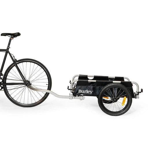 Burley Flatbed Cargo Trailer mounted to a bike's wheel hub studio image side view