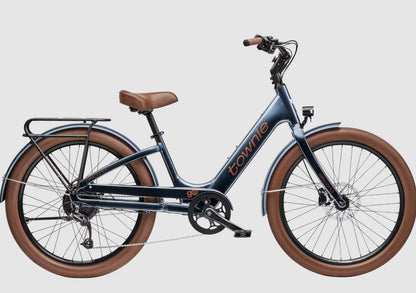 Blue Electra Townie Go! bicycle with brown tires on a light gray background