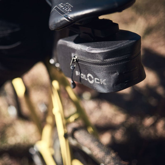 Fidlock PUSH Saddle Bag 600 and Saddle Base mounted to Mountain Bike's seat outdoor image