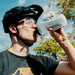 Mountain biker drinking from Fidlock 600 Water Bottle