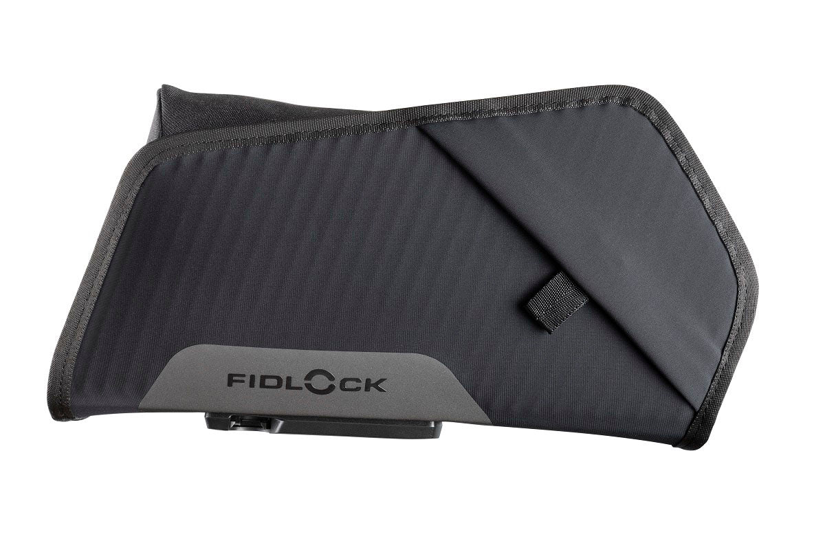 Studio side view of a large black Fidlock TWIST Essential bag with the Fidlock logo on the middle of the bottom of the bag. 