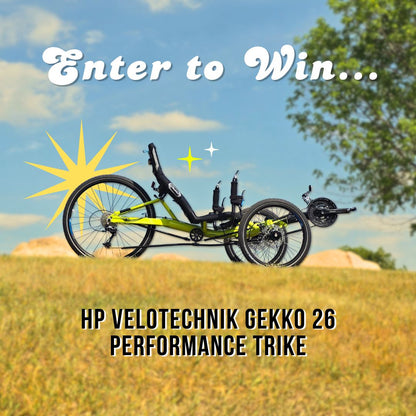 HP Velotechnik Gekko 26 Performance Trike in a field with 'Enter to Win' text above.