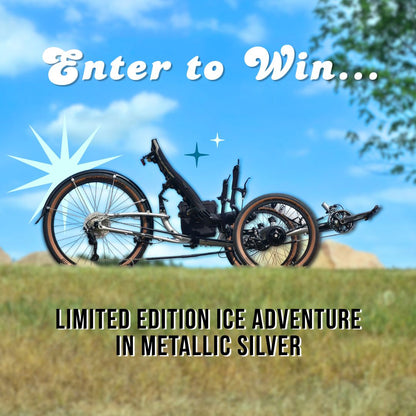 Limited edition ice adventure bike in metallic silver with a scenic background.