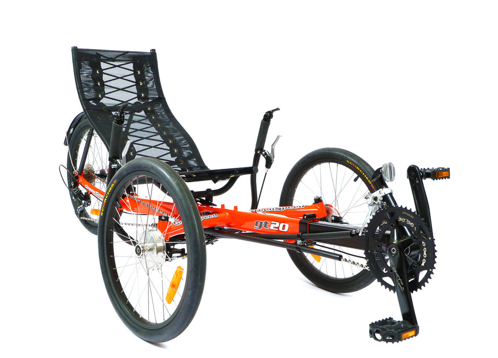 Greenspeed GT20 recumbent trike with 20 inch wheels, bright orange frame and black seat, front right profile view of chainrings, boom and front wheels.
