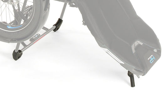 Studio image of a close up side view of the HP Velotechnik stand-up feet kit installed onto the back of the seat and back of the rack of a HP Velotechnik Delta trike. 