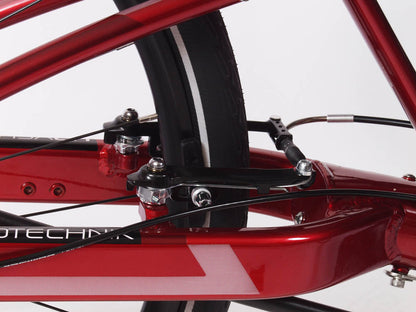 Close up studio image of parking brake installed on a red recumbent trike. 