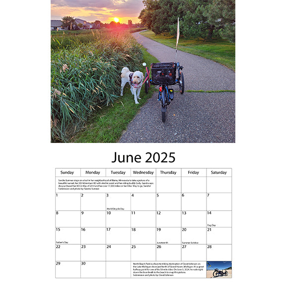 June 2025 shows a white dog standing by a blue ICE trike along a neighborhood bike trailw while the sun sets in the distance.