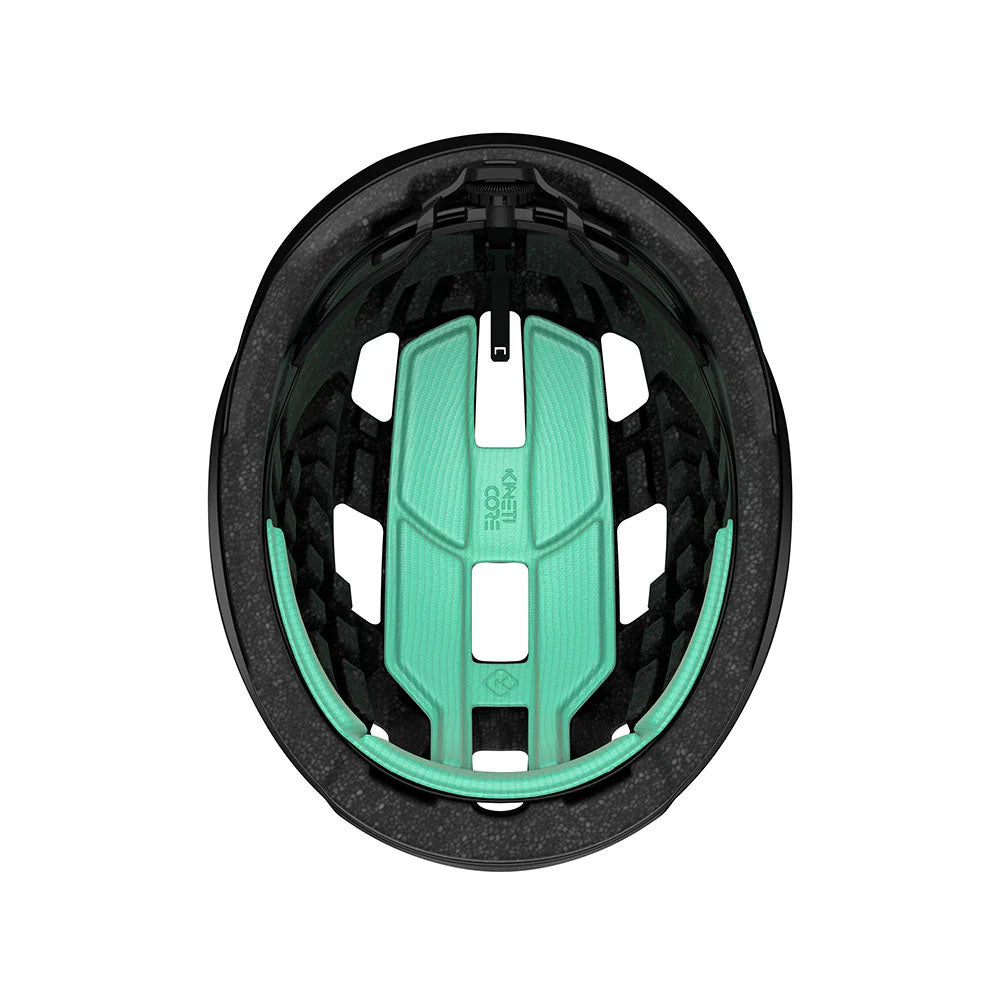 Sstudio inside view of a bicycle helmet with black foam core and mint green foam inserts for padding. 