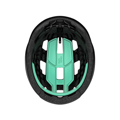 Sstudio inside view of a bicycle helmet with black foam core and mint green foam inserts for padding. 