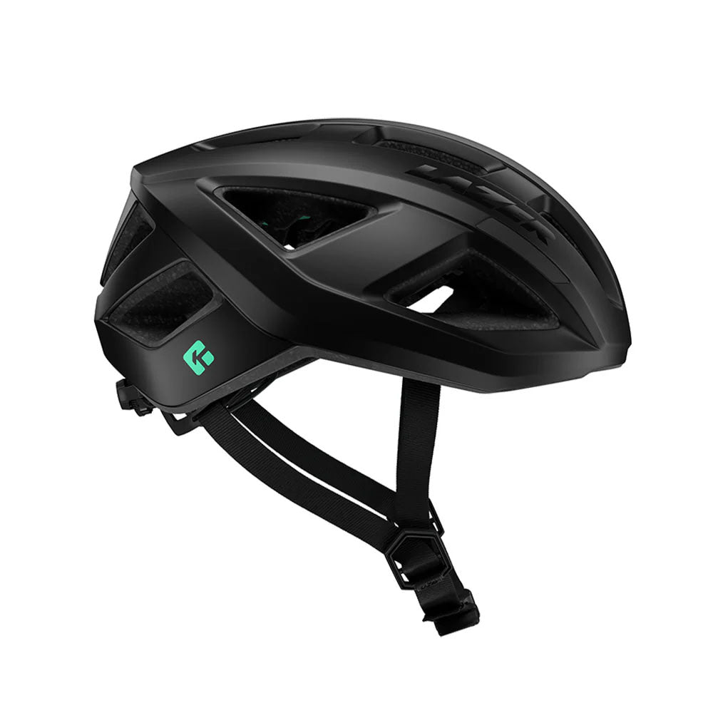 Studio side view of a matte black bicycle helmet with black straps and a mint green diamond behind the ear.area.  
