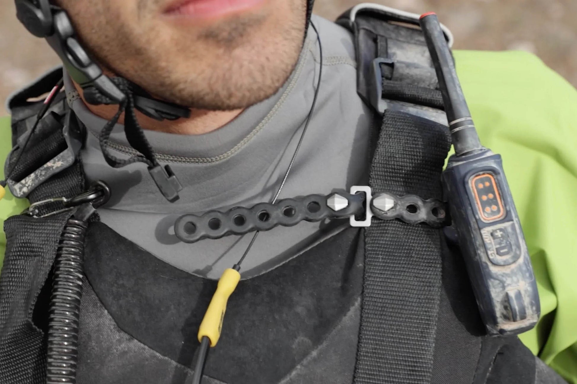 Modl 8" Infinity Tools 4 Pack black being used to secure a walkie talkie to a backpack