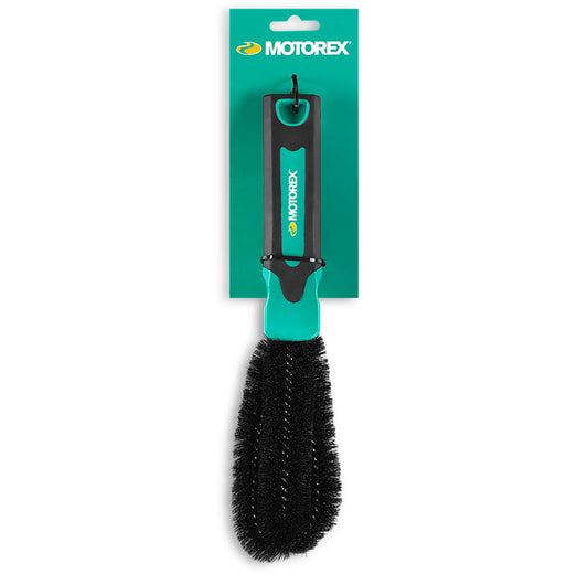 Studio front view of green and black handled brush with black bristles on display hang tag.