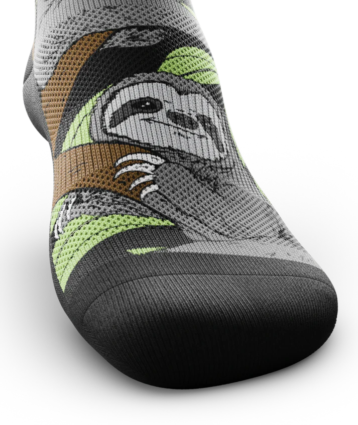 Top toe view of sock with sloths in trees on main part of sock