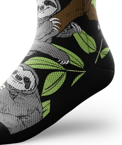 Side ankle view of sock with sloths in trees on main part of sock