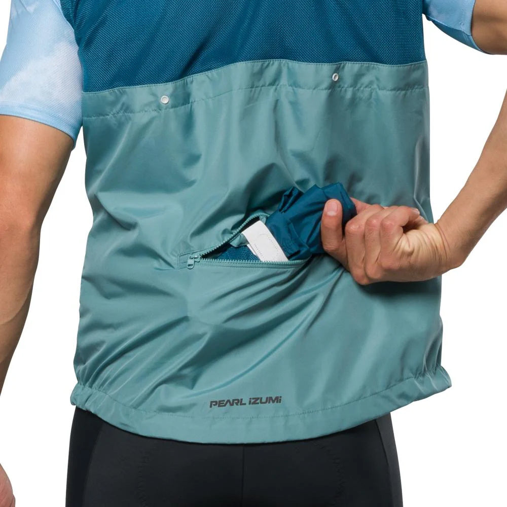 Pearl Izumi Mens Quest Barrier Convertible Jacket Nightfall Arctic, studio photo view of model putting something into the back pocket