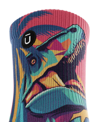 Top cuff of multicolored sock with T-rex and palm trees.  Small black circular patch with Outway logo on top third of sock.