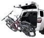 Saris SuperClamp EX 2 Bike Tray Hitch Car Rack On Vehicle with Bikes and Open Trunk Door Studio Image