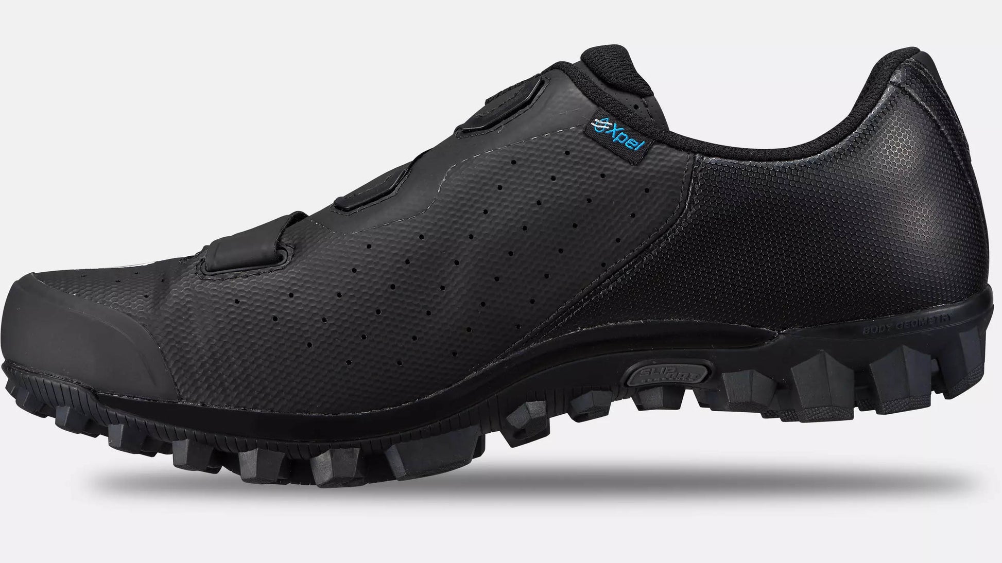 Studio image of the inner side of a black Specialized Recon 2.0 mountain bike shoe with black lugged sole.