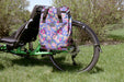 T-Cycle Easy Trike Rack (Reversible One Side) 1.0in mounted on a green ICE Adventure parked in the grass, with Po Campo Orchard Grocery Pannier