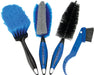 Set of four brushes, left brush has blue bristles and black handle, 2nd brush  has gray sponge along center and blue bristles on sides with black and blue handle, 3rd brush has black bristles and black and blue handle, and 4th tool has a blue handle with stiff black bristles and a curved toothed-plastic end.