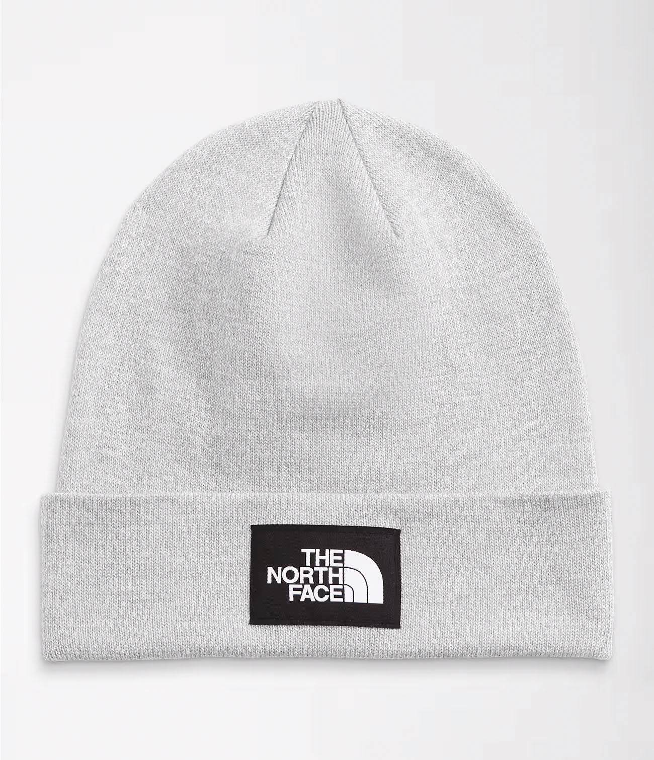 Studio image of light grey cuffed beanie with black and white The North Face logo patch in center of cuff. 