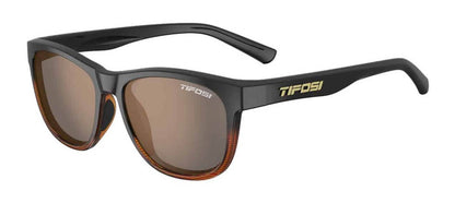 Studio image of left profile of dark brown sunglasses with gold Tifosi logo on left bow. 
