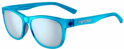 Studio image of left profile of sunglasses with bright blue frame and silver Tifosi logo on left bow.