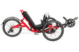 Right profile studio view of a Catrike Trail recumbent trike with a bright red frame, black crank arms, black boom, black seat pad, three 20 inch wheels and a black rear fender.