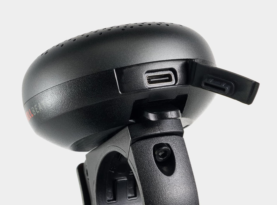 Trek BellBeats Digital Bike Bell and Speaker, studio side view detailing charging port