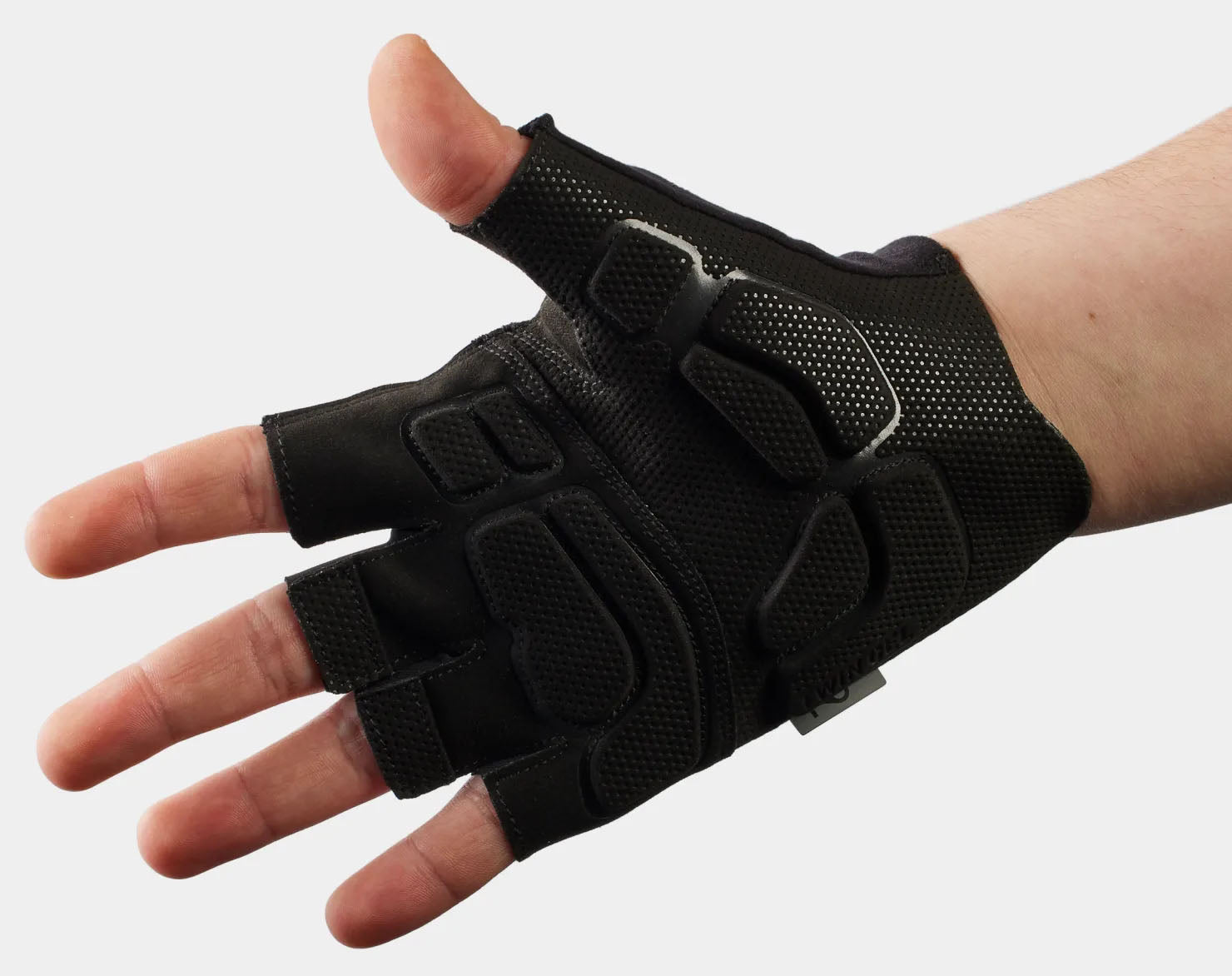 Studio palm view of black short-finger cycling gloves.