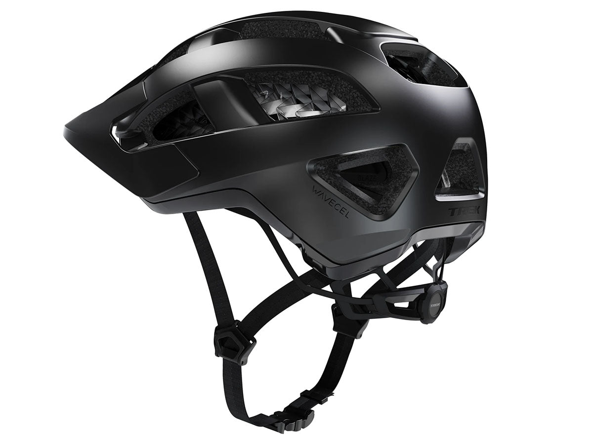 Studio left side view of a black bicycle helmet with five ventilation channels visible across the helmet, black visor, chin strap and size-adjustment dial. 