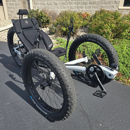 Angled side view of the Azub Demo Fat Bosch Performance CX Dynamic Grey Recumbent Trike in an outdoor setting.