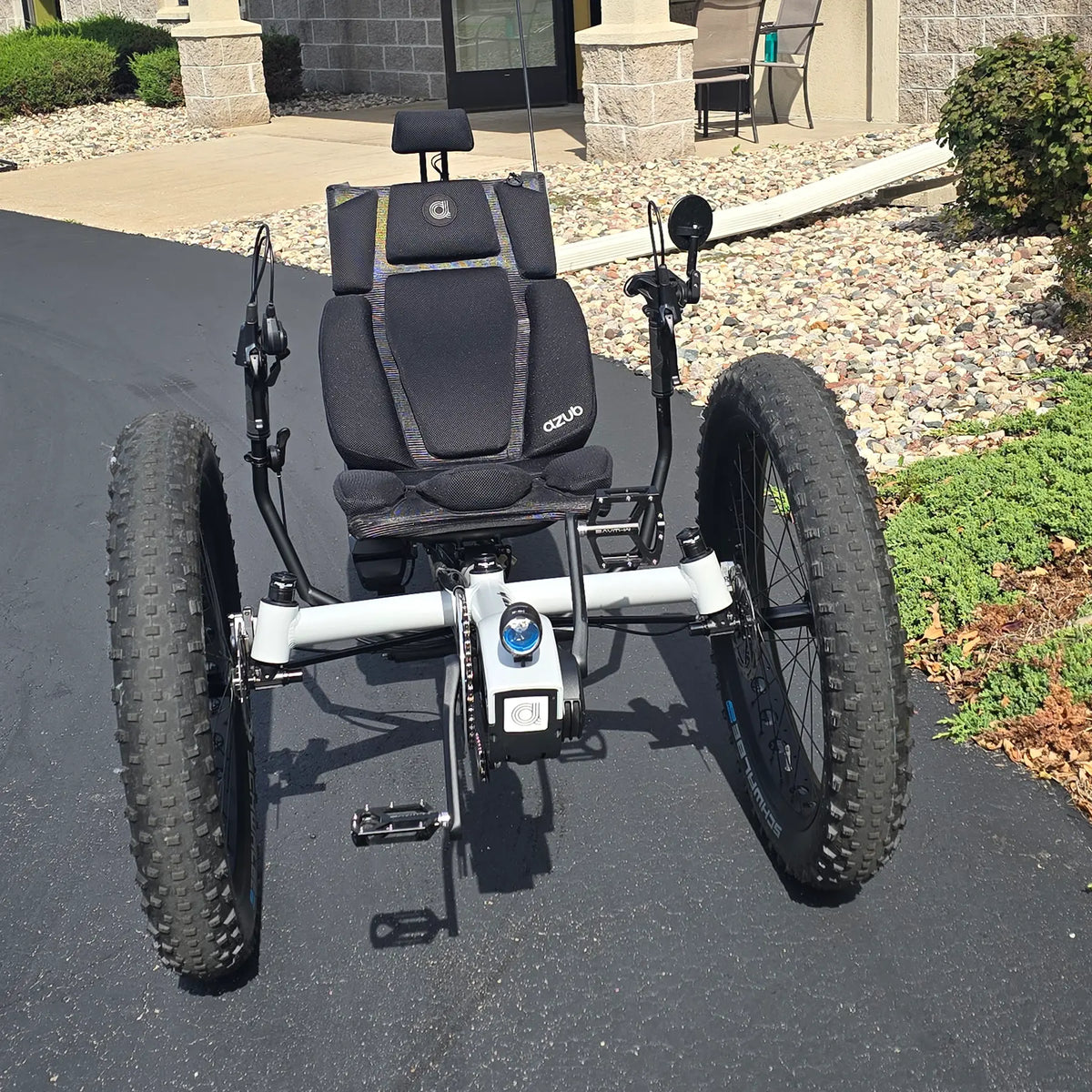 Front view of the Azub Demo Fat Bosch Performance CX Dynamic Grey Recumbent Trike in an outdoor setting.